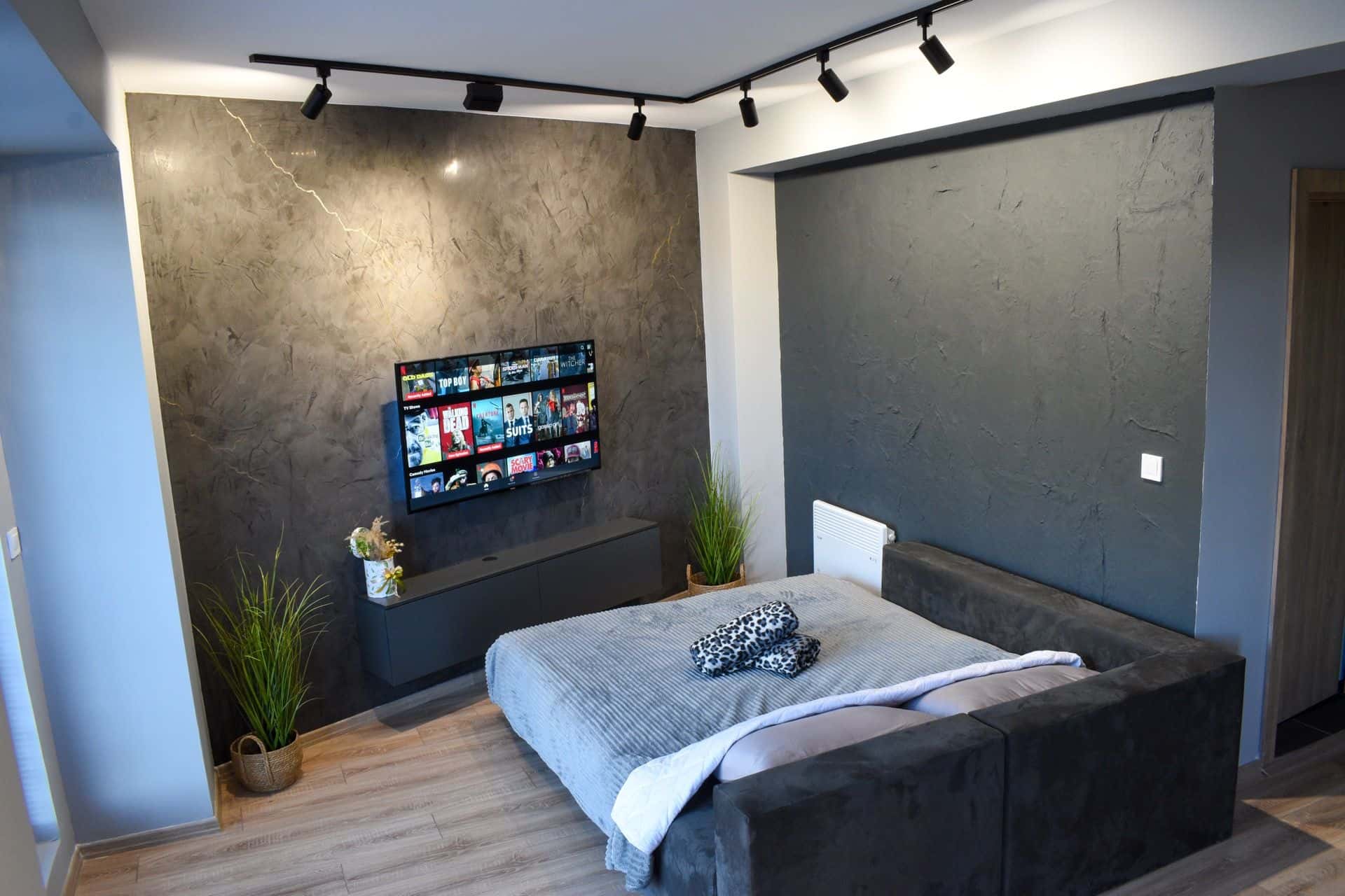 TV wall with textured plaster finish